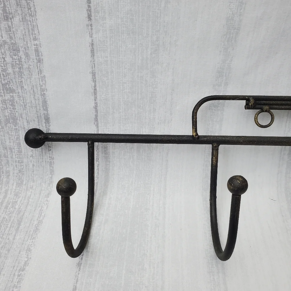 DecorativeIron Trumpet Shape Wall Hook Black w/hints of gold. 21